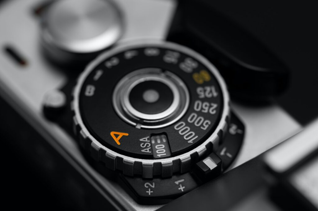 Shutter speed dial with exposure compensation values on a vintage film camera