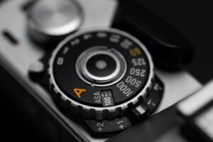 Shutter speed dial with exposure compensation values on a vintage film camera