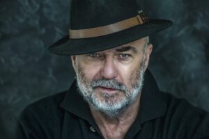 Portrait of senior man with hat